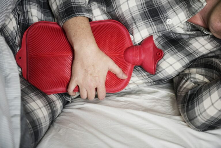 Caucasian woman having painful period cramps