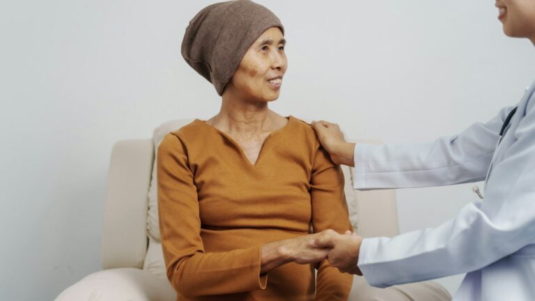 Elderly Asian female patients and cancer specialists meet by appointment to receive treatment advice